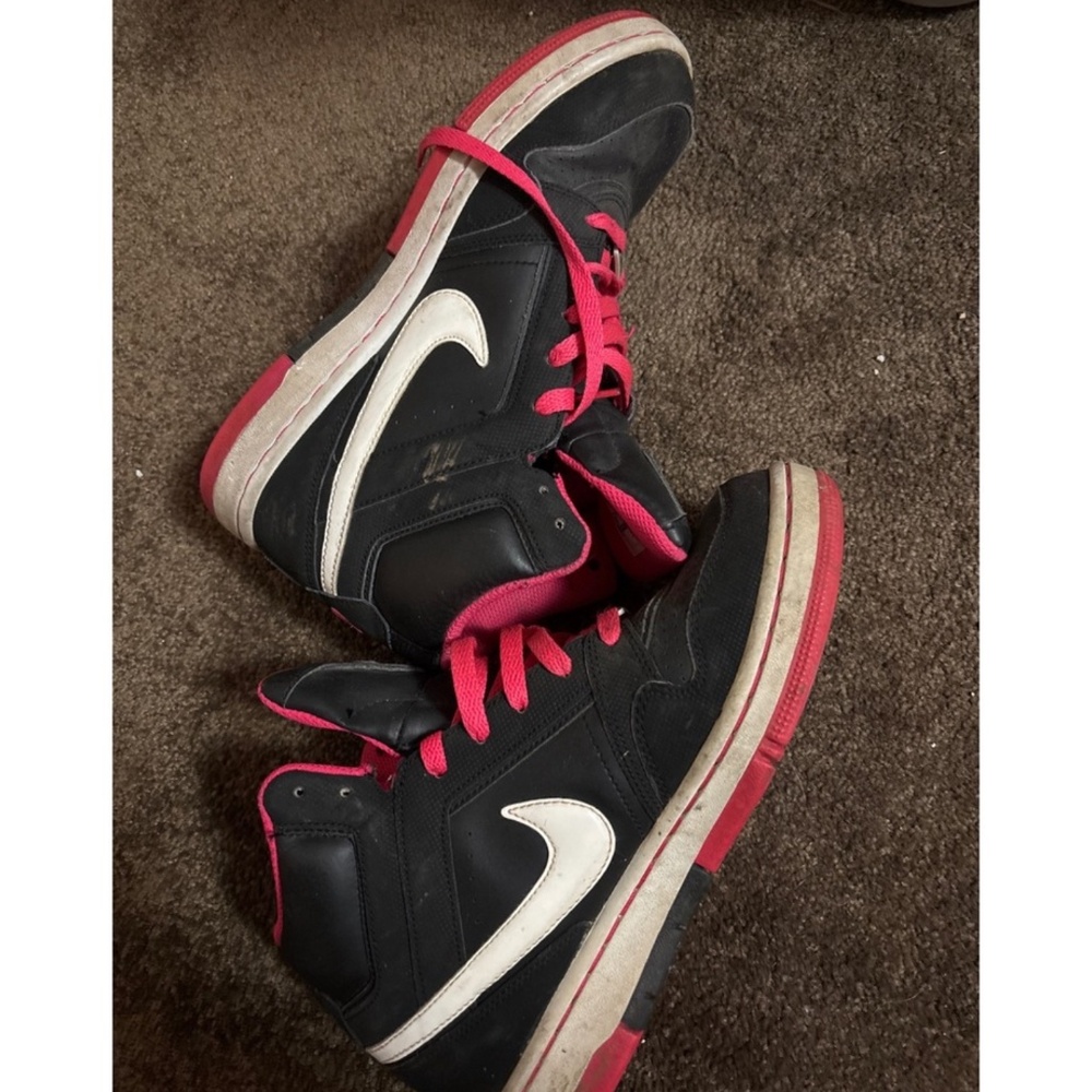 Black and pink Nike high tops well worn